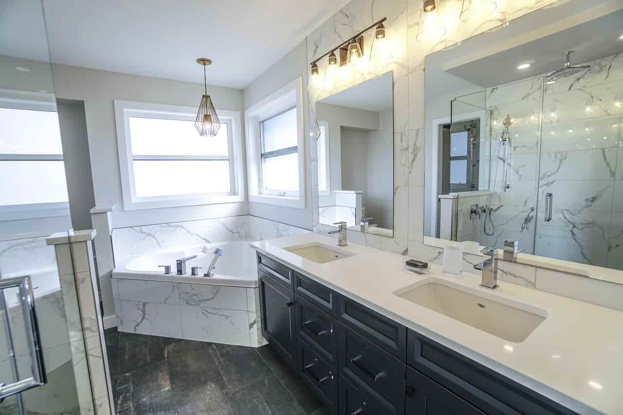 Luxury bathroom upgrade with freestanding tub and frameless glass shower in Sugar Land